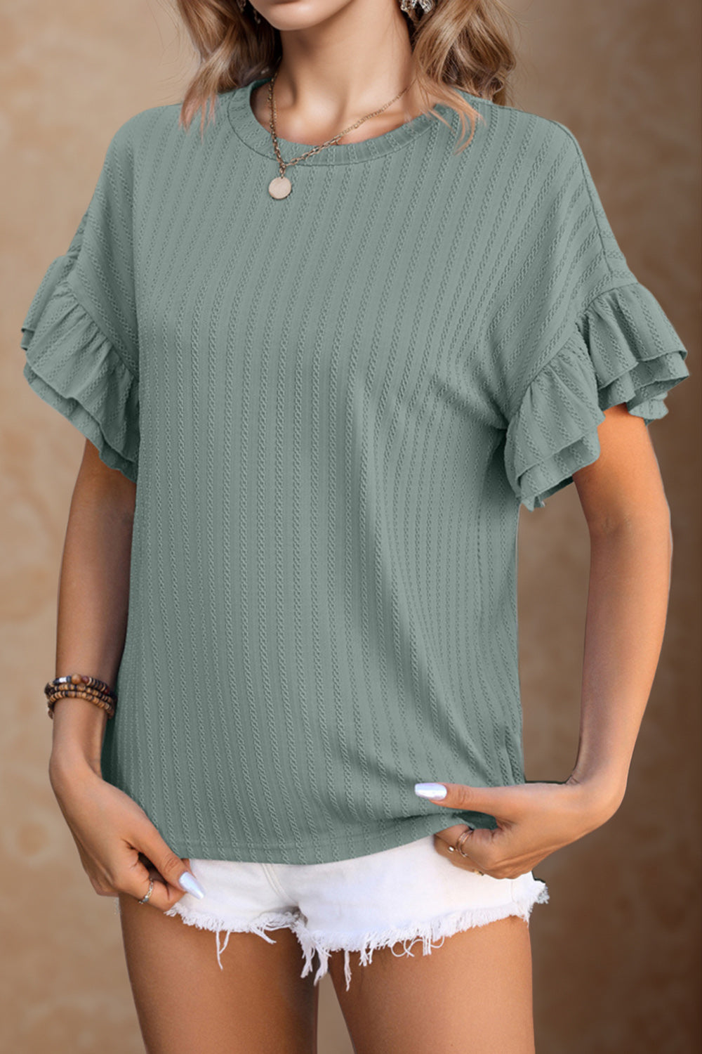 Blusa con cuello redondo y mangas con volantes