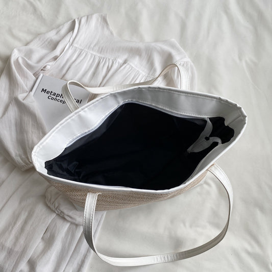 Tragetasche mit Riemen aus geflochtenem Strohleder