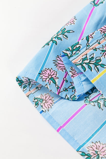 Bluse mit gesmoktem Blumenmuster und Schleife am Hals