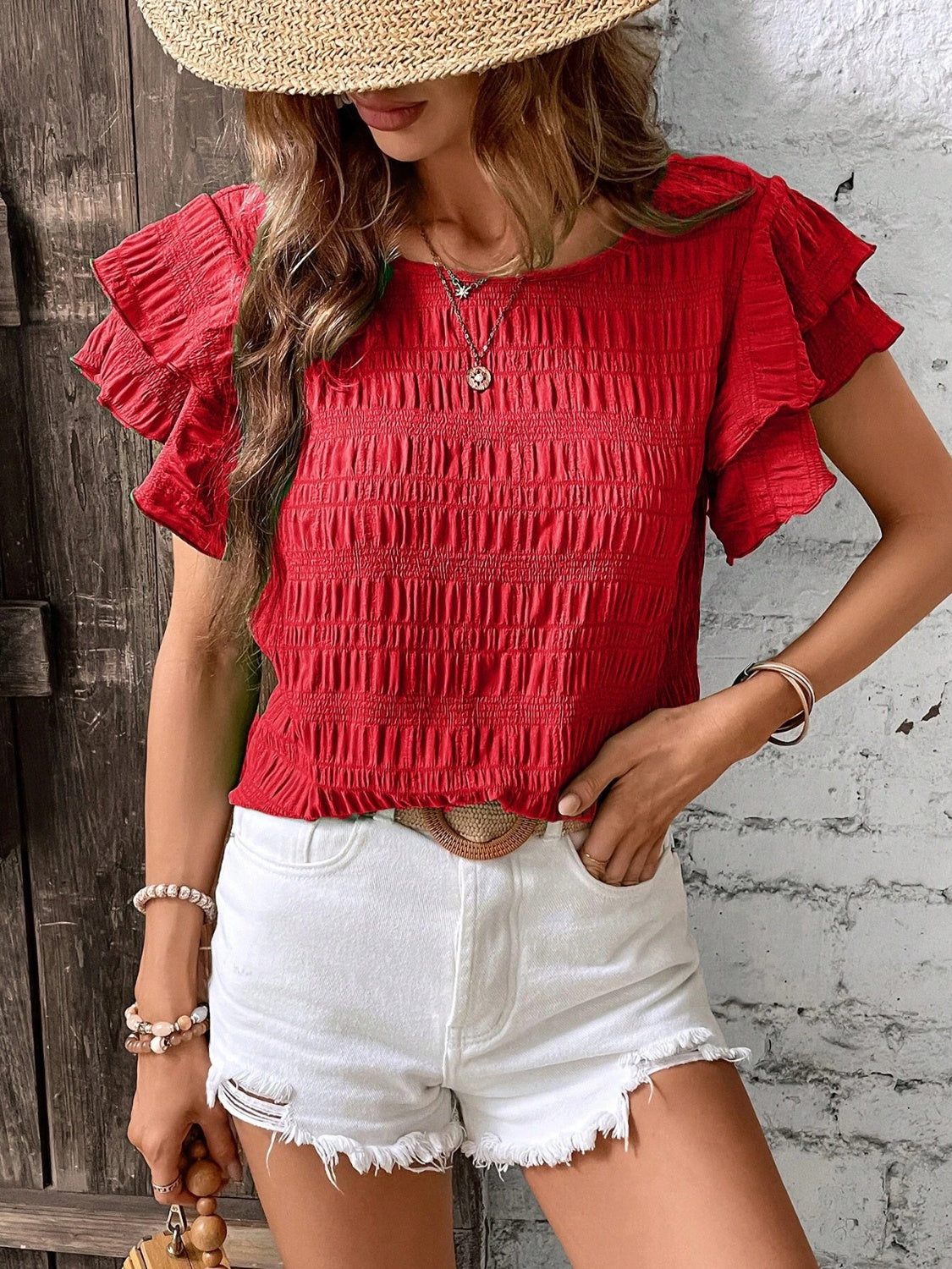 Blusa con cuello redondo y mangas con volantes
