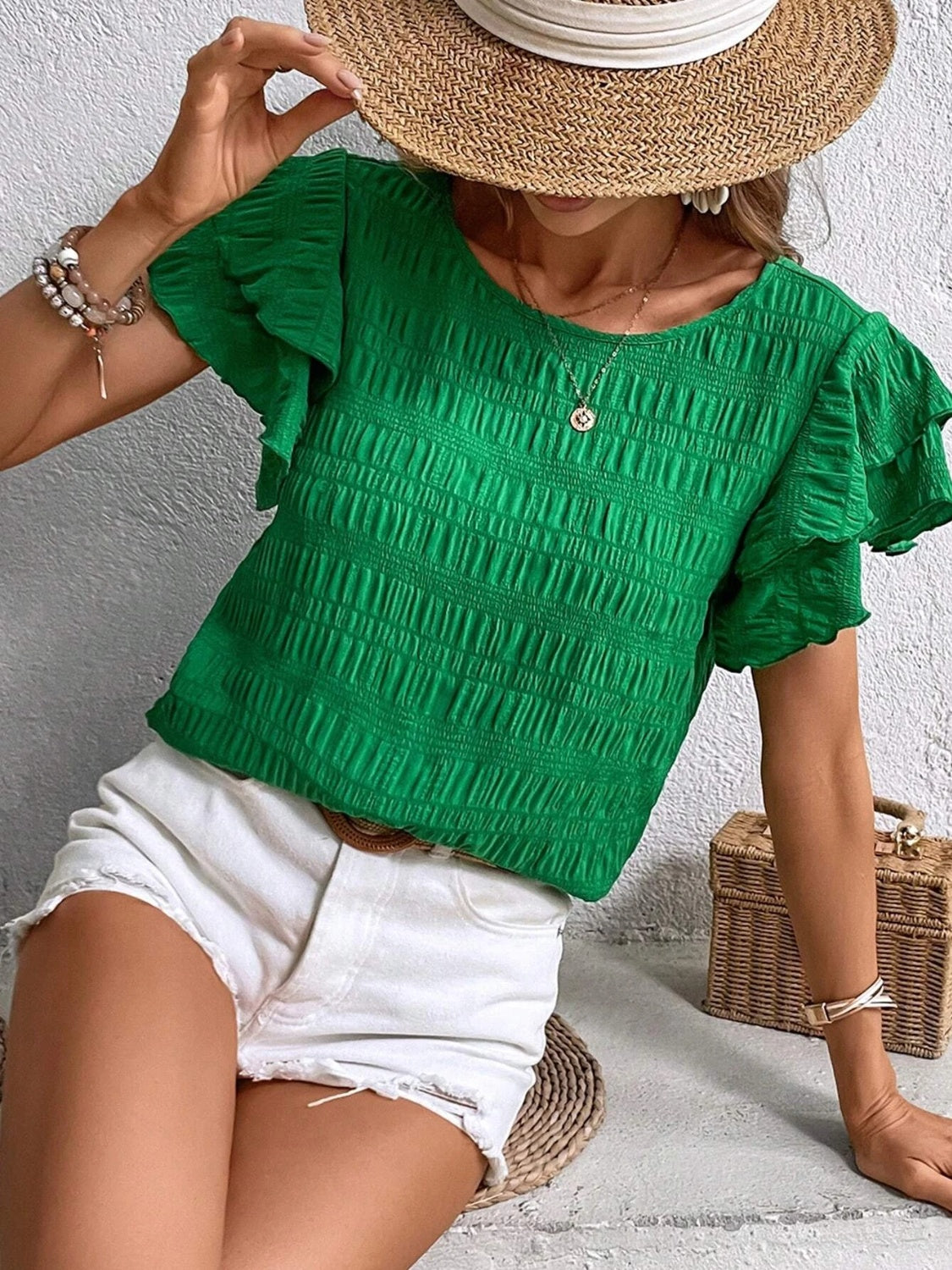 Blusa con cuello redondo y mangas con volantes