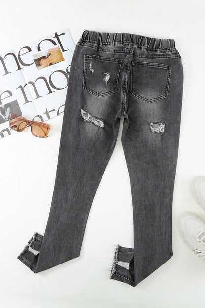 Distressed-Jeans mit Kordelzug, offenem Saum und Taschen