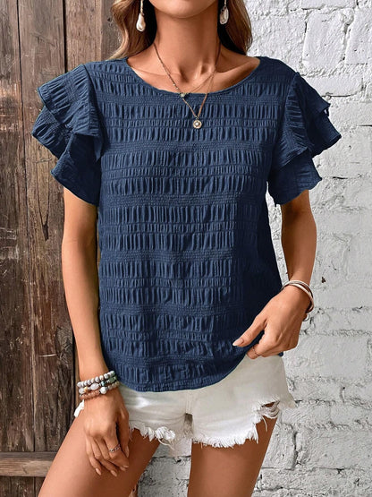 Blusa con cuello redondo y mangas con volantes