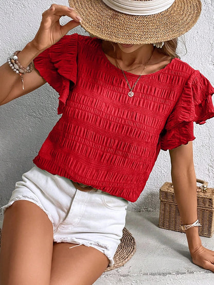 Blusa con cuello redondo y mangas con volantes
