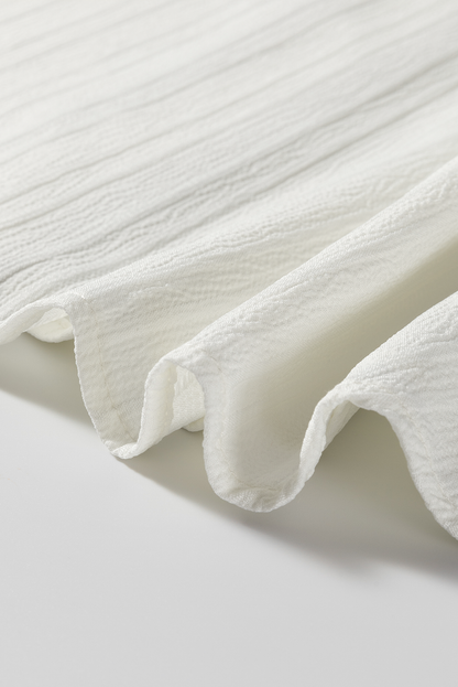 Bluse mit kontrastierenden Einkerbungen und langen Ärmeln