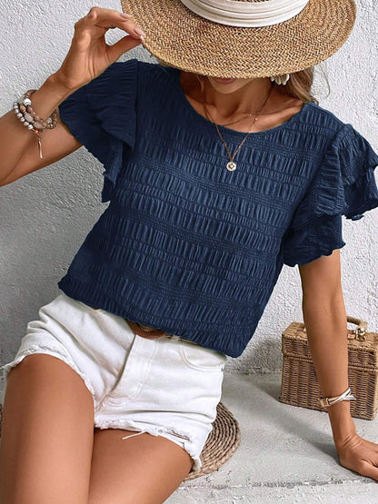 Blusa con cuello redondo y mangas con volantes