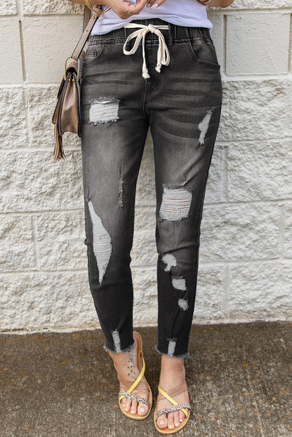 Distressed-Jeans mit Kordelzug, offenem Saum und Taschen