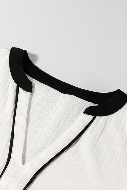 Bluse mit kontrastierenden Einkerbungen und langen Ärmeln