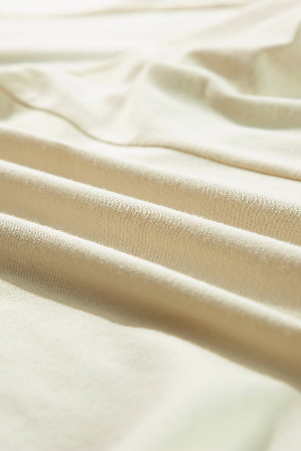 Langärmliges Oberteil mit seitlichem Schlitz und Kerbe