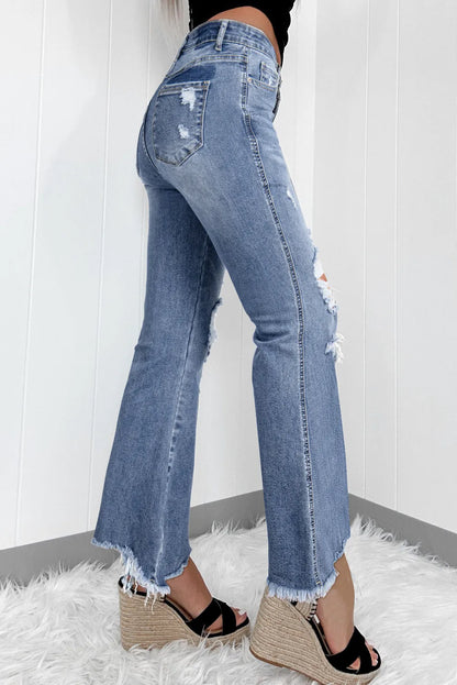 Bootcut-Jeans mit Used-Look und offenem Saum