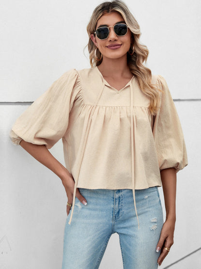 Bluse mit Ballonärmeln und Bindeband am Ausschnitt