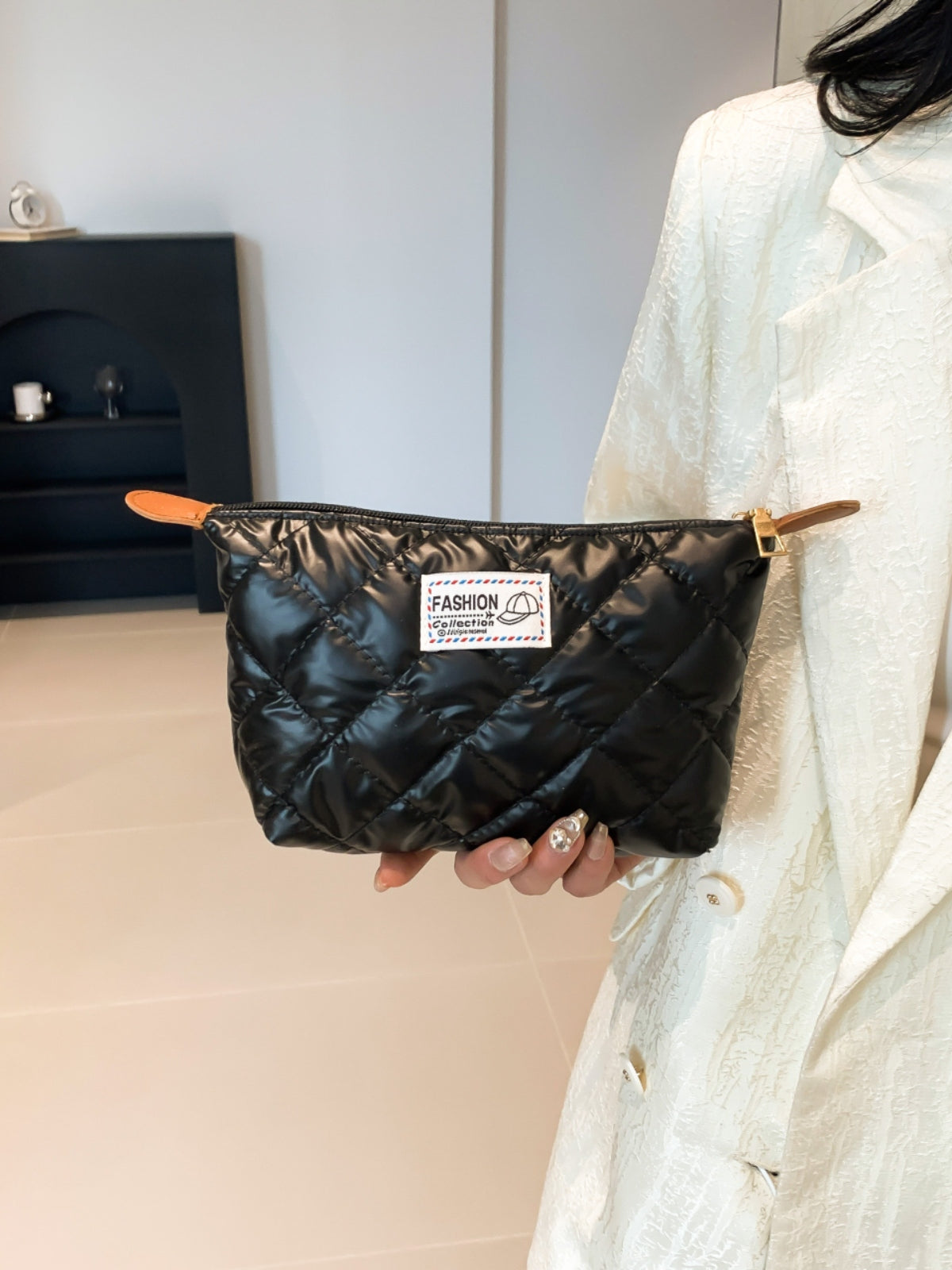 Solide gesteppte Clutch mit Reißverschluss