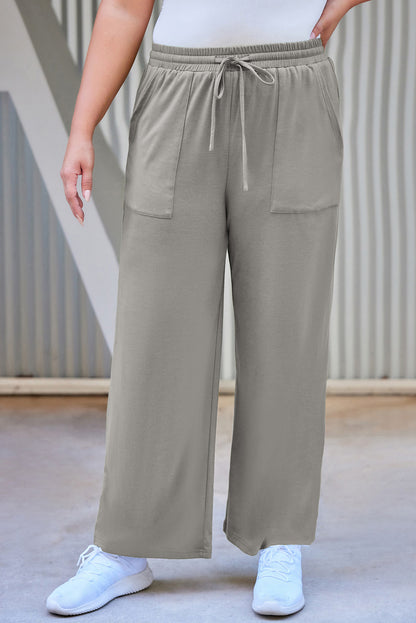 Pantalones rectos con cordón y bolsillos de talla grande