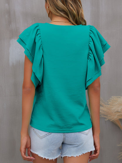 Blusa con cuello redondo y mangas con volantes