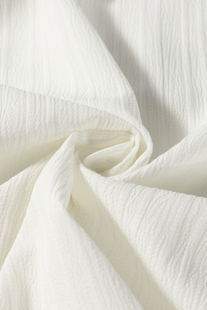 Bluse mit kontrastierenden Einkerbungen und langen Ärmeln