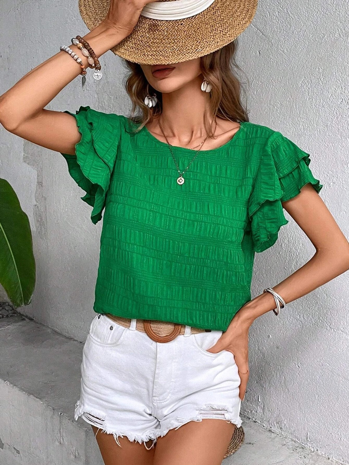 Blusa con cuello redondo y mangas con volantes