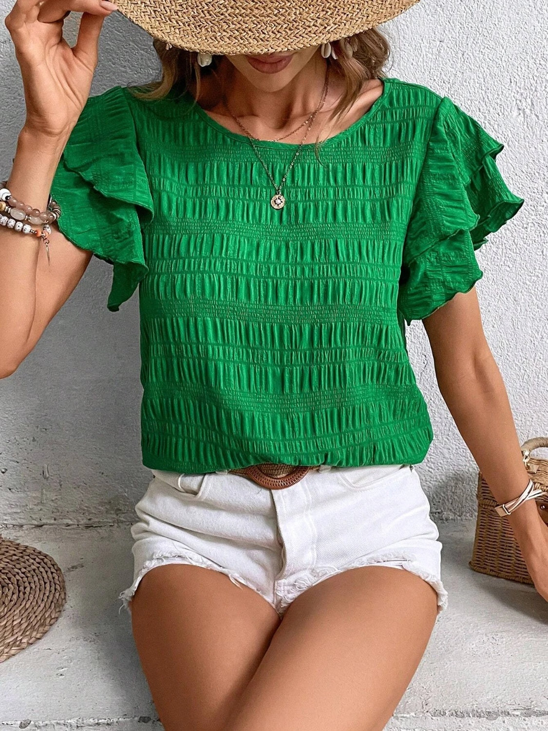 Blusa con cuello redondo y mangas con volantes