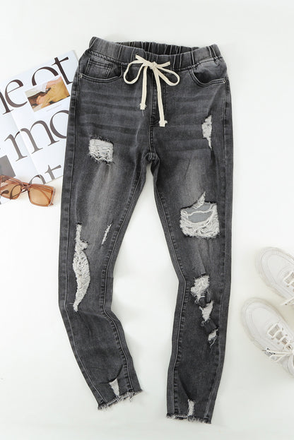 Distressed-Jeans mit Kordelzug, offenem Saum und Taschen