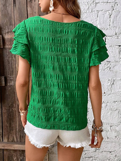 Blusa con cuello redondo y mangas con volantes