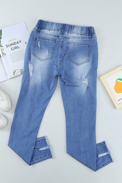 Distressed-Jeans mit Kordelzug, offenem Saum und Taschen