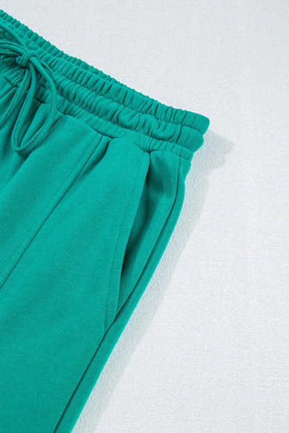 Set aus langärmligem Oberteil mit Rundhalsausschnitt und Hose mit Kordelzug in voller Größe