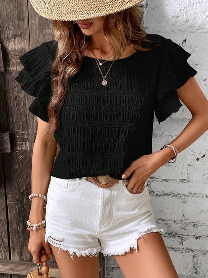 Blusa con cuello redondo y mangas con volantes