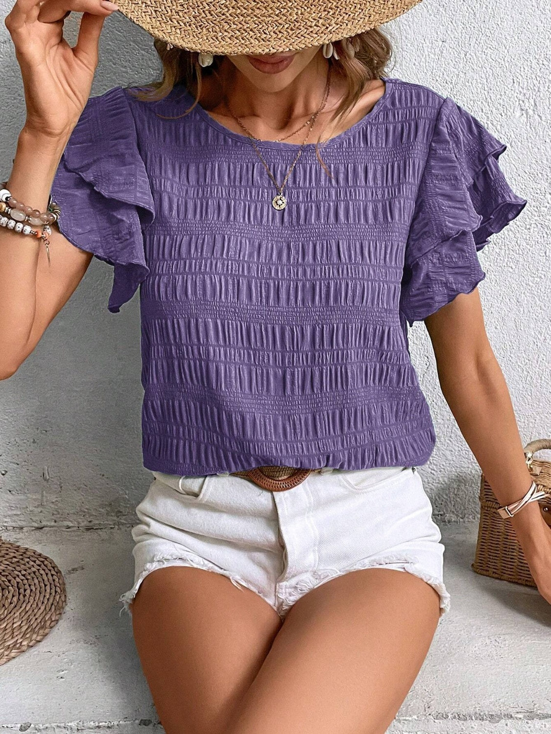 Blusa con cuello redondo y mangas con volantes