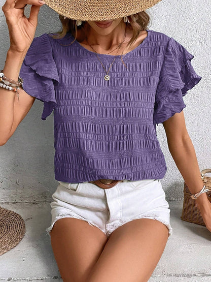 Blusa con cuello redondo y mangas con volantes