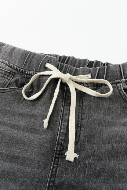 Distressed-Jeans mit Kordelzug, offenem Saum und Taschen