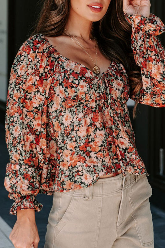 Langärmlige Bluse mit Schößchen und Blumenmuster