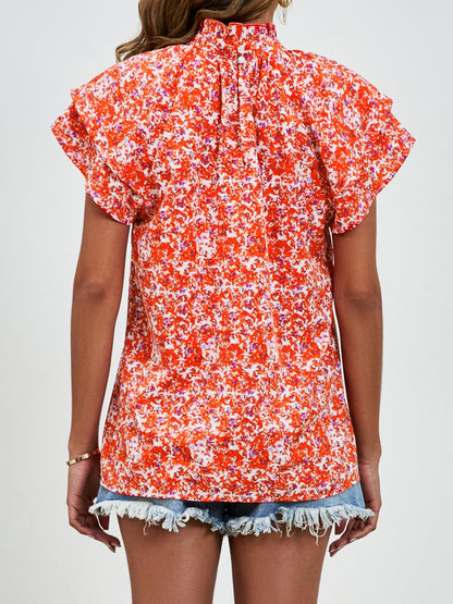 Bluse mit Rollkragen und Volantärmeln und Blumenmuster