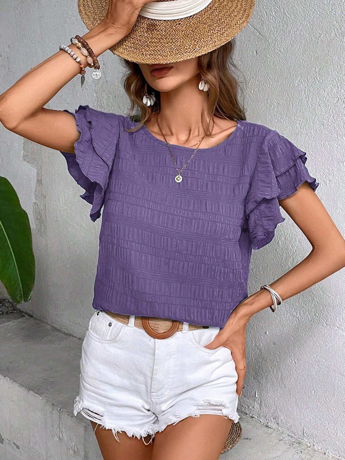 Blusa con cuello redondo y mangas con volantes