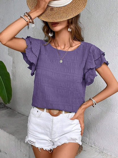 Blusa con cuello redondo y mangas con volantes