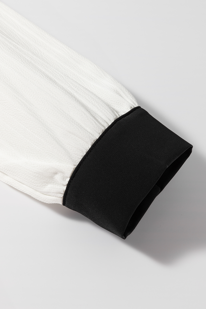 Bluse mit kontrastierenden Einkerbungen und langen Ärmeln
