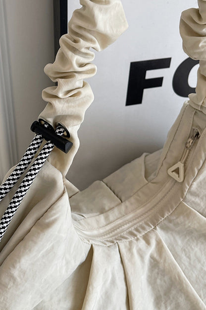 Umhängetasche mit Kordelzug und Rüschen