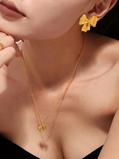 Set aus Ohrringen und Halskette mit Schleife aus 18 Karat vergoldetem Edelstahl