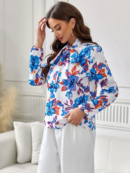 Langärmlige Bluse mit Blumenmuster und Bindeband am Kragen