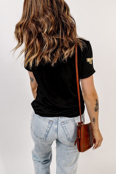 T-Shirt mit Rundhalsausschnitt und Pailletten und Schleife