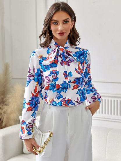 Langärmlige Bluse mit Blumenmuster und Bindeband am Kragen