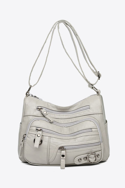 Bolso bandolera de piel sintética con múltiples bolsillos