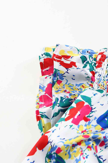 Bluse mit Blumenmuster und gesmokten Flügelärmeln in Übergröße